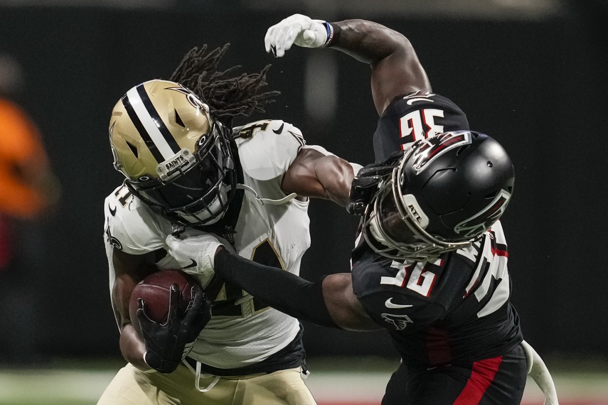 New Orleans Saints running back Alvin Kamara (41) straight arms Atlanta Falcons safety Shawn Williams (36). Mandatory Credit: Dale Zanine-USA TODAY